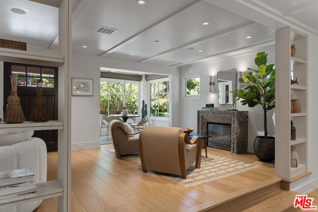 929 Marco Place Venice, CA 90291 - Photo 24 of 56 a living room with furniture a large window and a fireplace