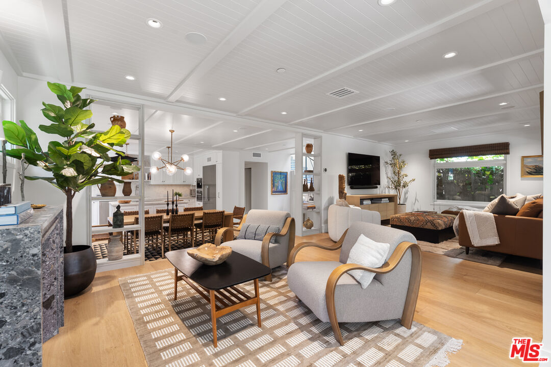 929 Marco Place Venice, CA 90291 - Photo 3 of 56 a living room with fireplace furniture and a wooden floor