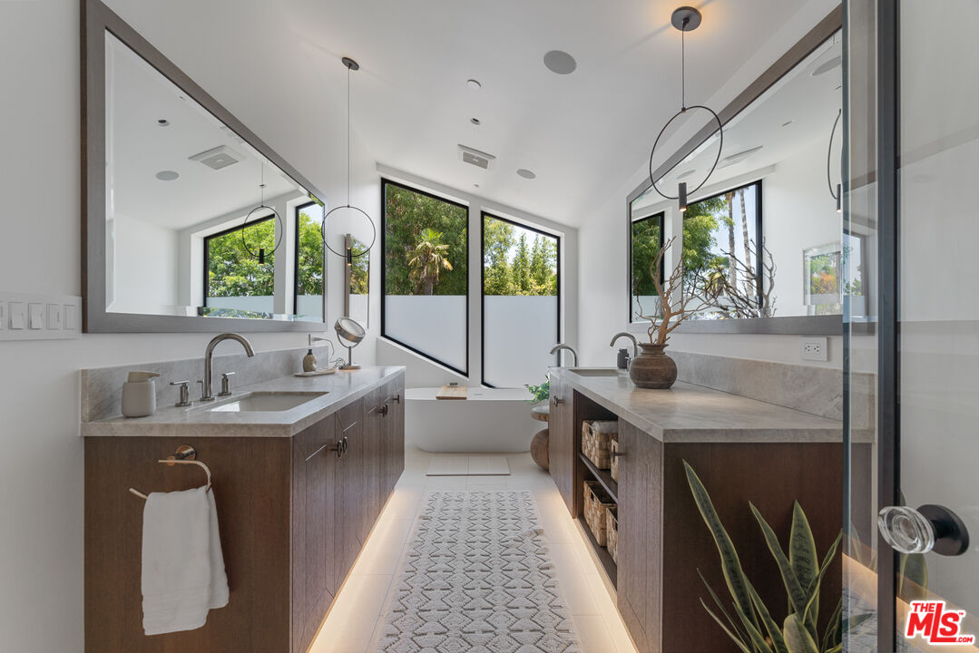 929 Marco Place Venice, CA 90291 - Photo 42 of 56 a kitchen with sink a window and stainless steel appliances