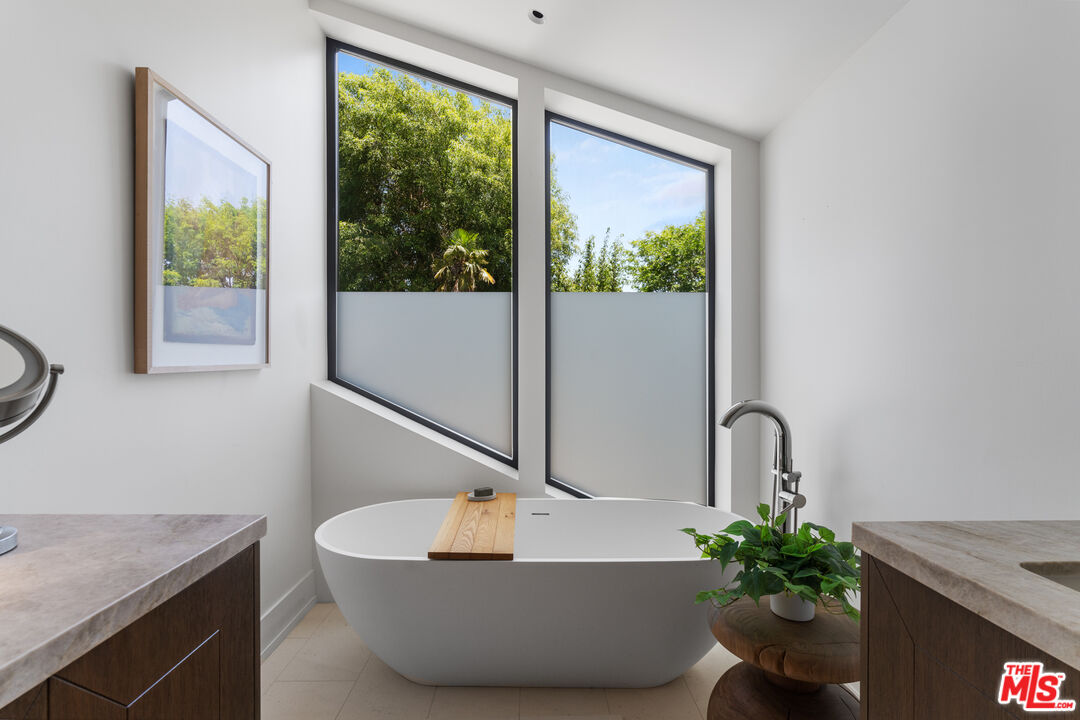 929 Marco Place Venice, CA 90291 - Photo 45 of 56 a bath room with a sink and a window