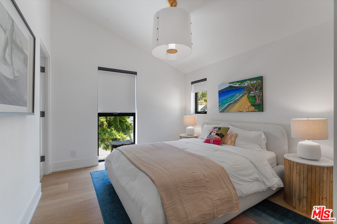 929 Marco Place Venice, CA 90291 - Photo 47 of 56 a bedroom with a bed and a window