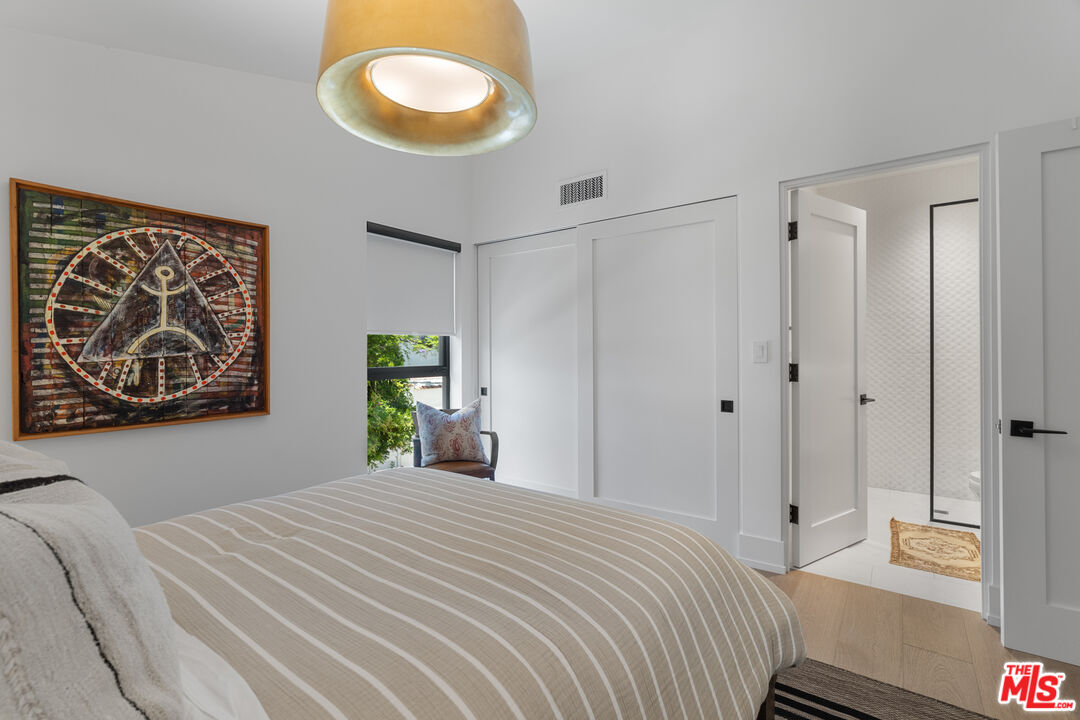 929 Marco Place Venice, CA 90291 - Photo 51 of 56 a bedroom with a bed and a window