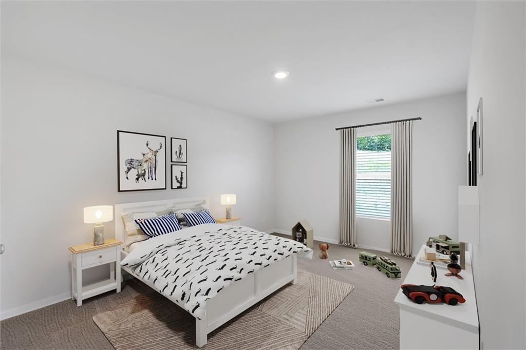 107 Lavender Circle Calhoun, GA 30701 - Photo 21 of 32 a bedroom with a bed lamp and a window