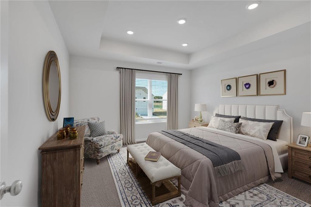 107 Lavender Circle Calhoun, GA 30701 - Photo 23 of 32 a bedroom with a bed and a mirror