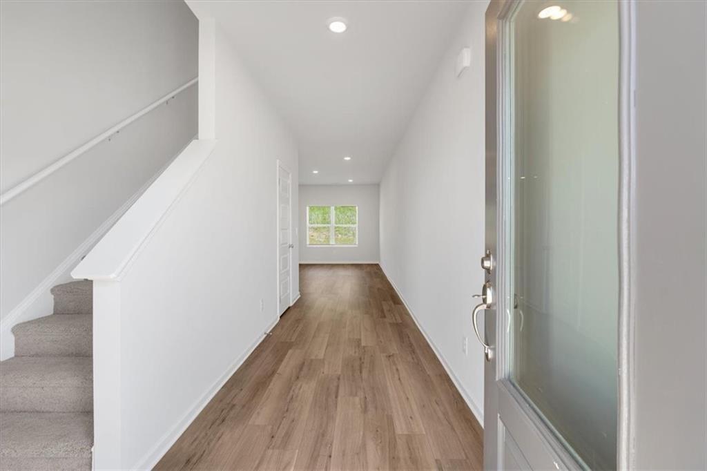 107 Lavender Circle Calhoun, GA 30701 - Photo 5 of 32 a view of a hallway with wooden floor