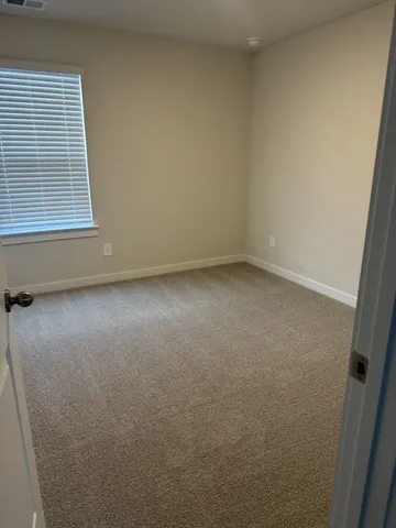 a view of a room that has a window in it