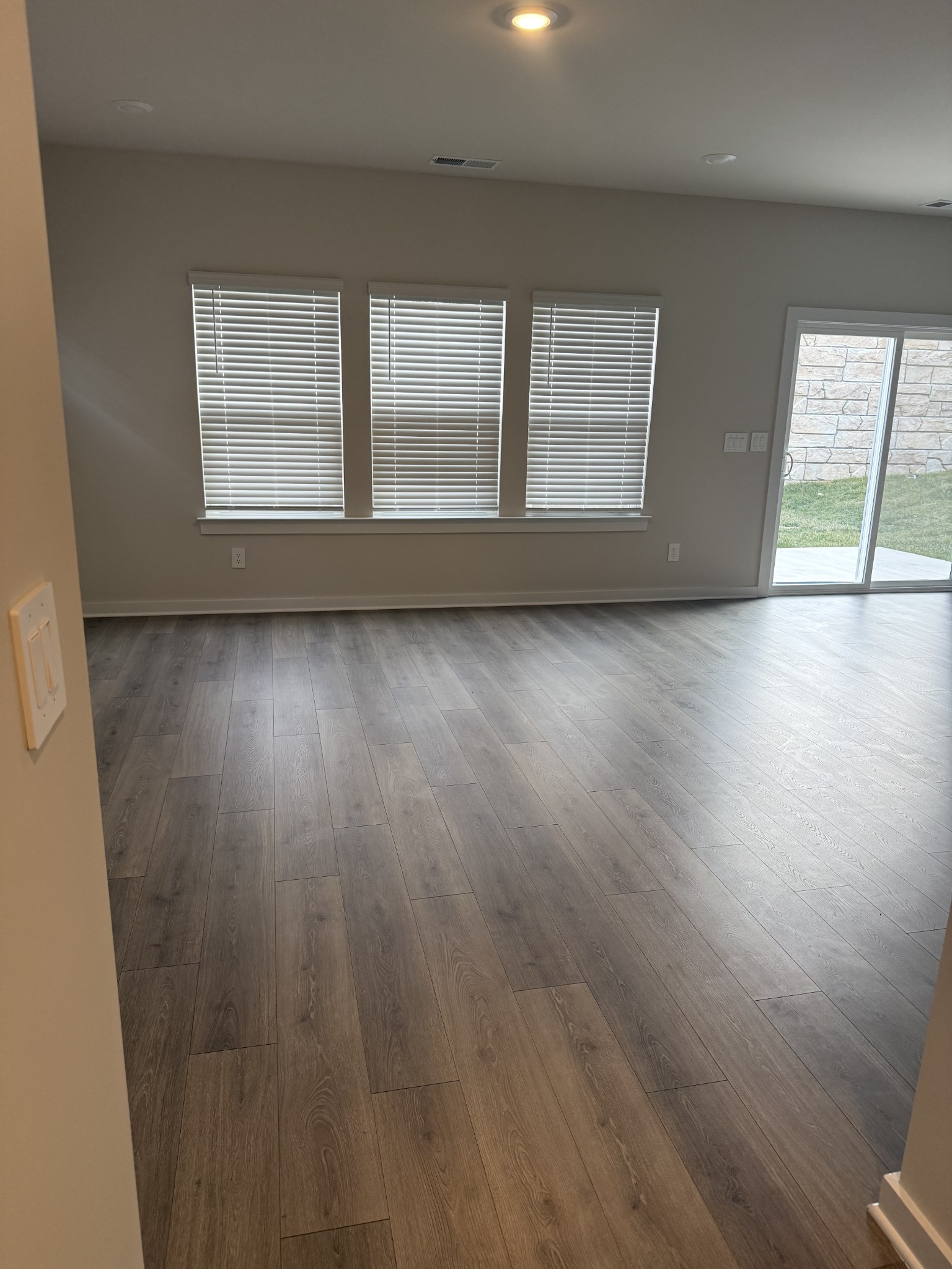 4105 Walnut Rdg Drive Nashville, TN 37207 - Photo 2 of 19 an empty room with wooden floor and windows