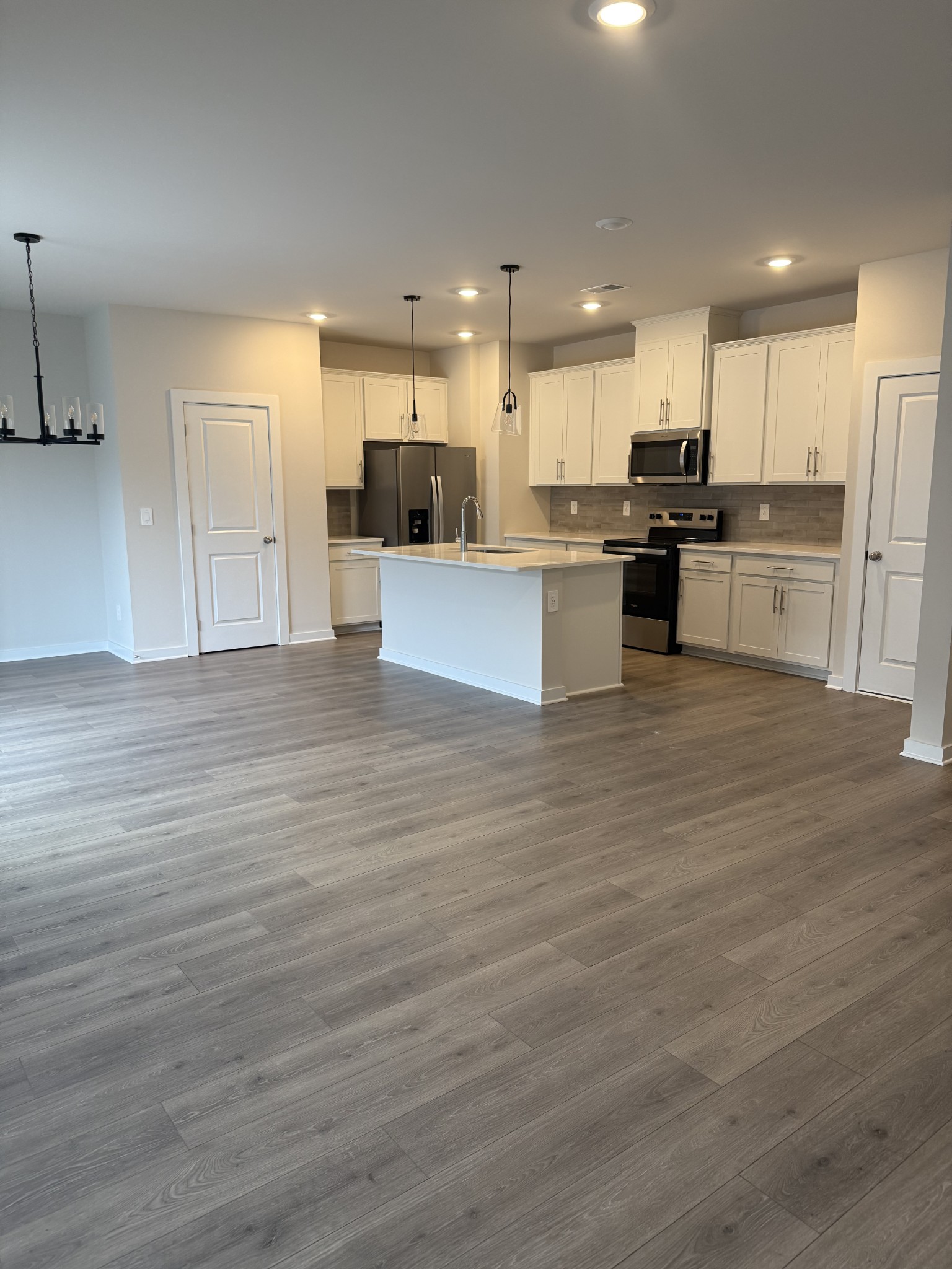 4105 Walnut Rdg Drive Nashville, TN 37207 - Photo 3 of 19 a large kitchen with stainless steel appliances granite countertop a stove and a refrigerator