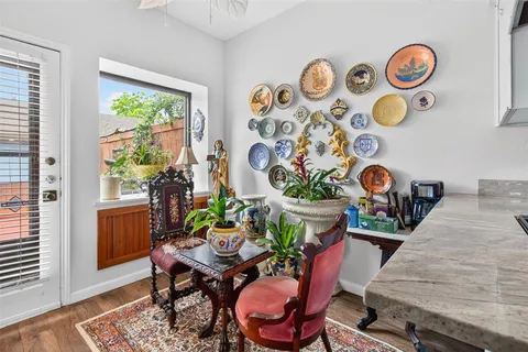 a view of a dining room with furniture and a window