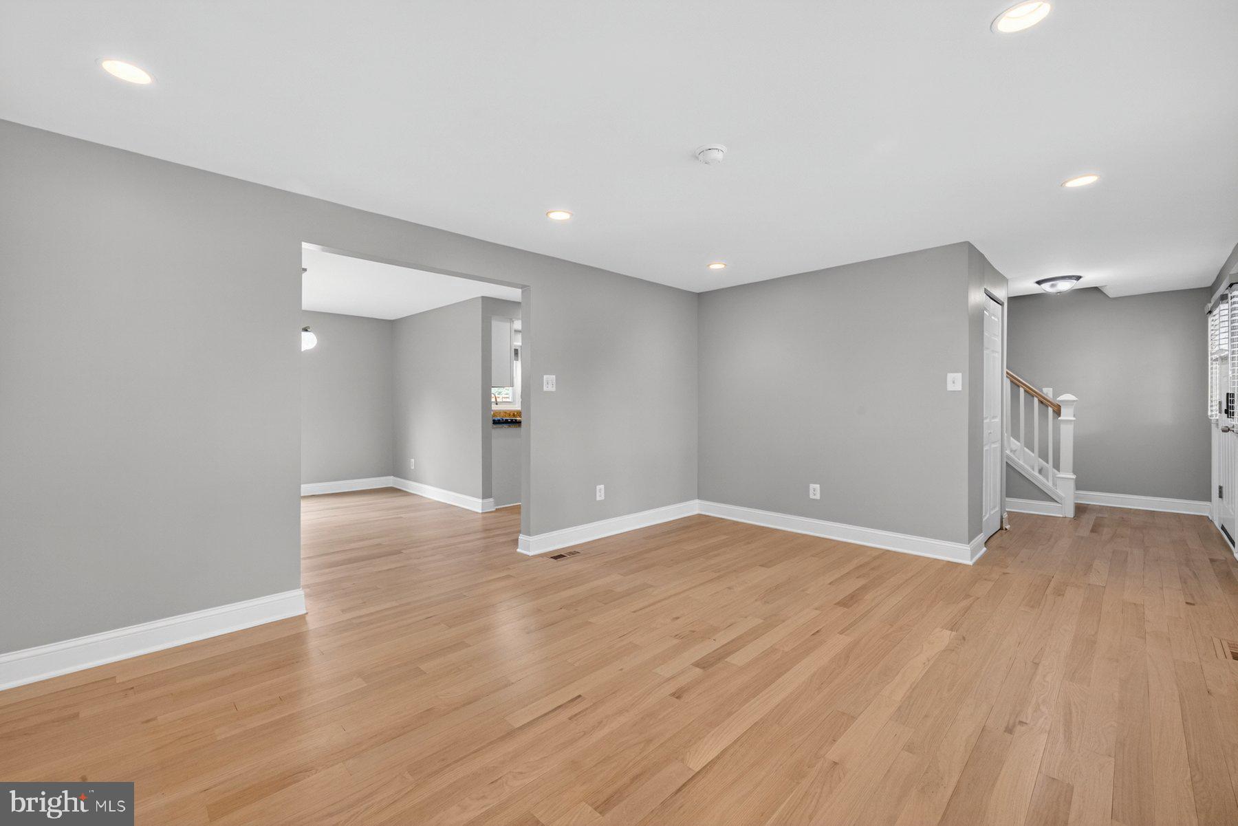 7518 Candytuft Court Springfield, VA 22153 - Photo 7 of 47 a view of an empty room with wooden floor and a window