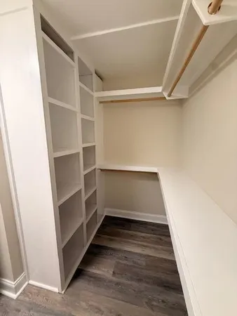 a view of an empty walk in closet
