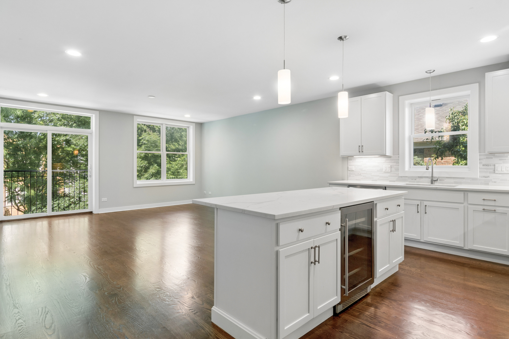 4845 North Keystone Avenue, Unit 2N Chicago, IL 60630 - Photo 8 of 21 a kitchen with a stove a sink a center island and a window