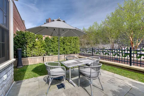 a view of an outdoor sitting area with furniture and backyard