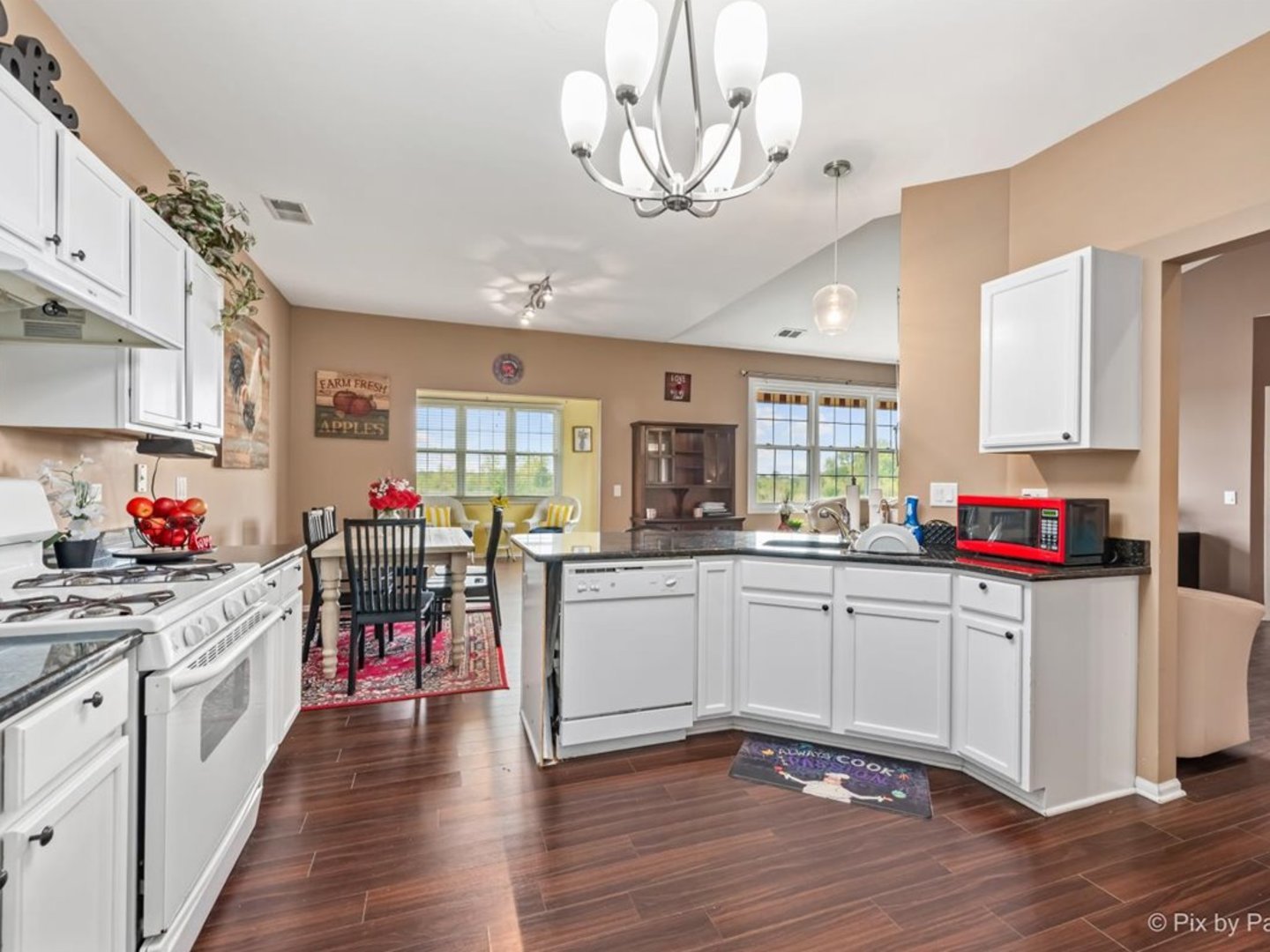17228 Como Avenue Lockport, IL 60441 - Photo 11 of 32 a kitchen with kitchen island granite countertop a sink cabinets and wooden floor