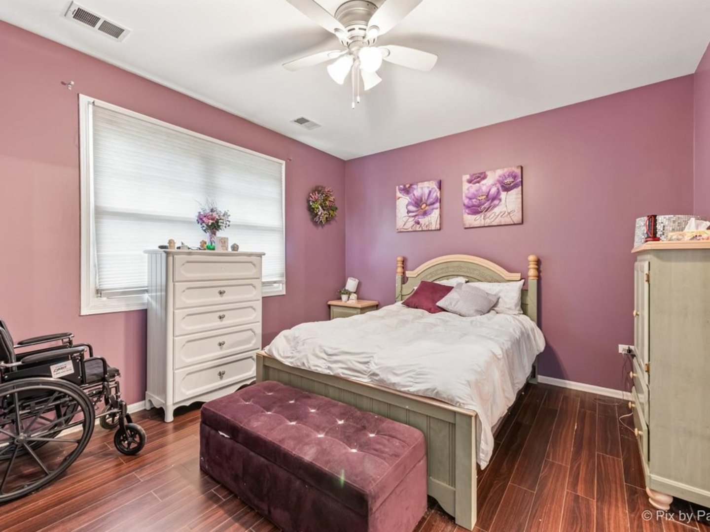 17228 Como Avenue Lockport, IL 60441 - Photo 14 of 32 a bedroom with a bed and a chandelier