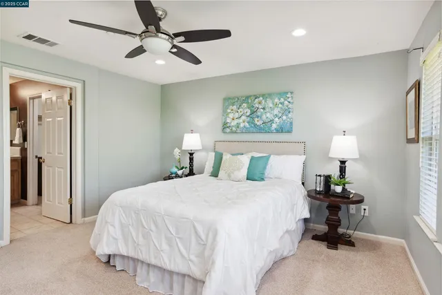 a bathroom with a double vanity sink mirror and double
