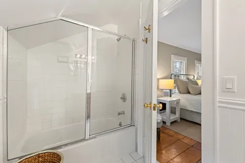 a bathroom with a shower and a toilet