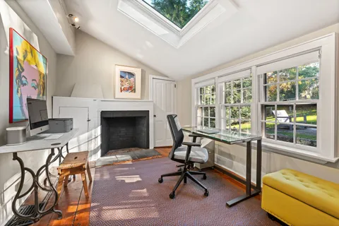 a view of a livingroom with furniture and a fireplace