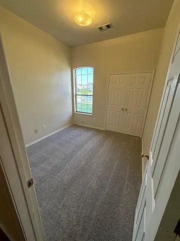 a view of room with window and stairs