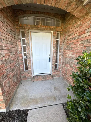 a view of house with backyard