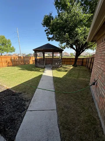 a view of a backyard with an outdoor space
