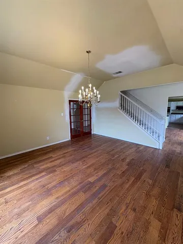 a view of a livingroom with wooden floor