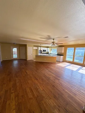 a room with wooden floors and view