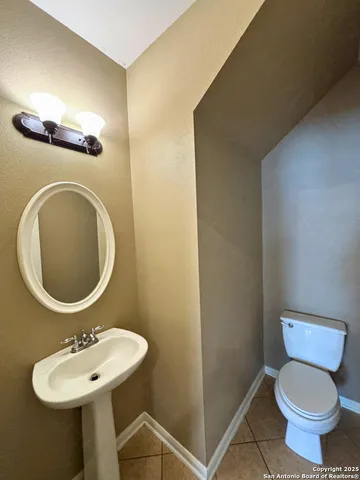 a view of an empty room with a fireplace