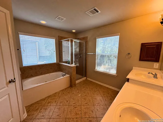 a backyard of a house with a tree