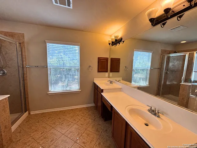 a view of a backyard with a tree