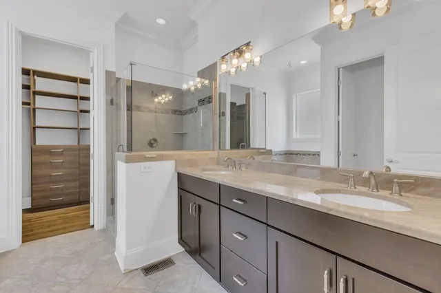 a bathroom with a double vanity sink and a mirror