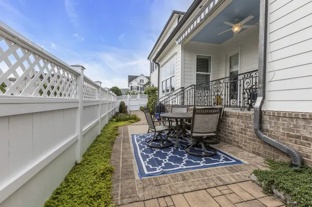 a view of a chair and tables in the balcony