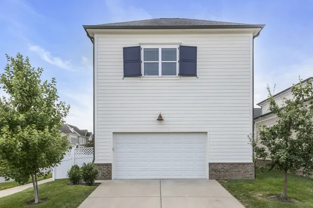 a front view of a house with a garage