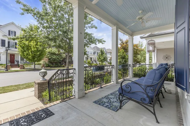 a view of a chair and tables in the balcony