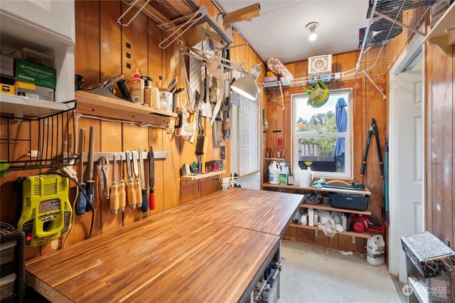 a view of a patio with table and chairs