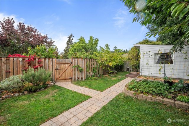 a backyard of a house with lots of green space