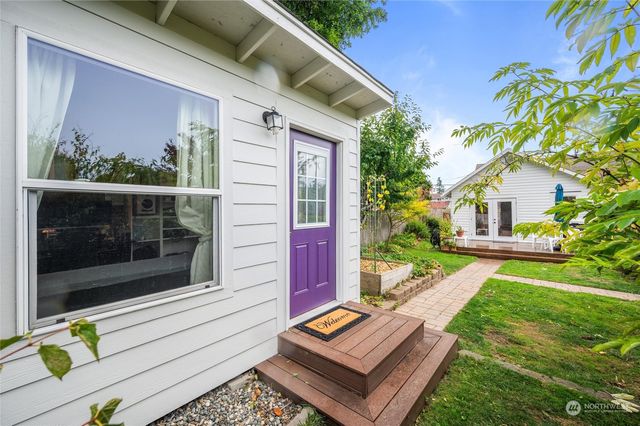 a view of a two chairs in the patio