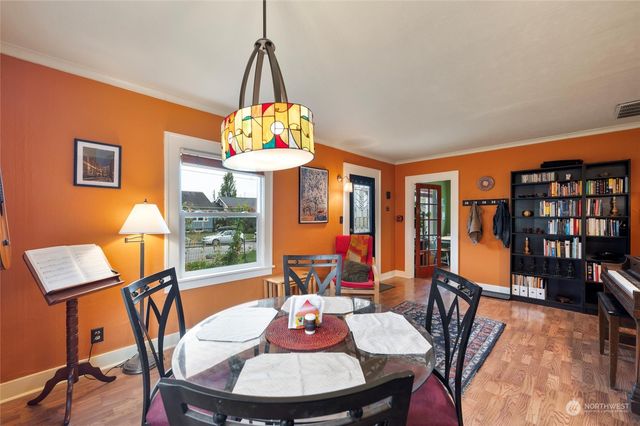 a view of a dining room with furniture window and wooden floor