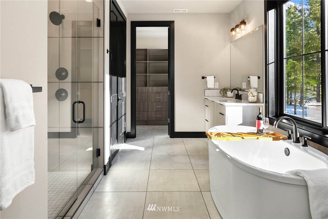 651 Bakers Road Ronald, WA 98940 - Photo 18 of 39 a bathroom with a tub sink and mirror