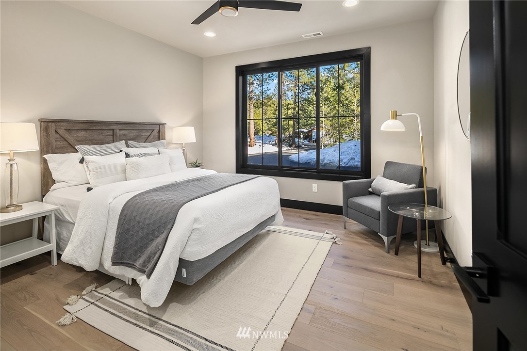 651 Bakers Road Ronald, WA 98940 - Photo 19 of 39 a bedroom with a bed and large windows