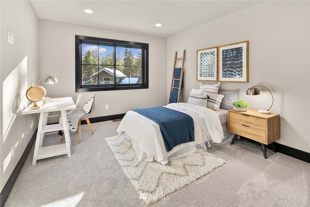 651 Bakers Road Ronald, WA 98940 - Photo 25 of 39 a bedroom with a bed and a painting on the wall