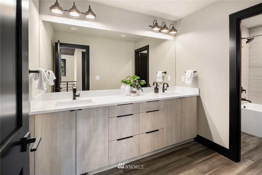 651 Bakers Road Ronald, WA 98940 - Photo 27 of 39 a bathroom with a double vanity sink a mirror and shower