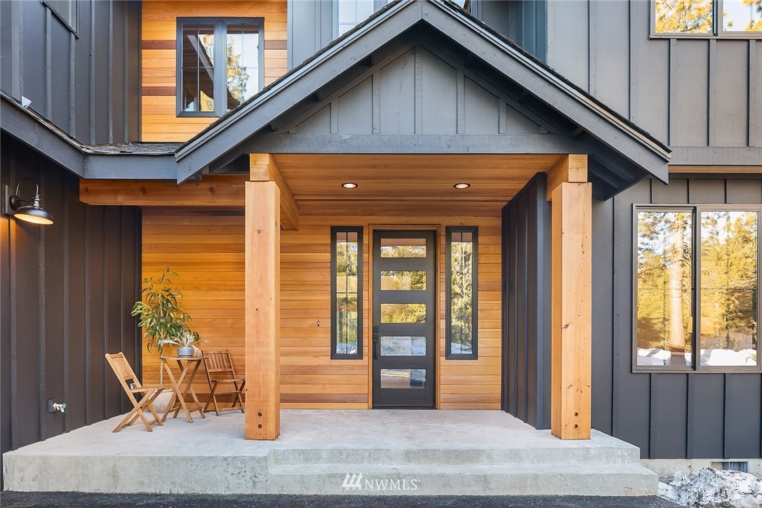 651 Bakers Road Ronald, WA 98940 - Photo 3 of 39 a front view of a house with glass windows
