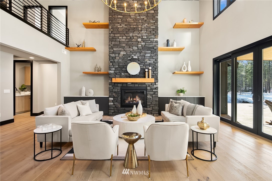 651 Bakers Road Ronald, WA 98940 - Photo 6 of 39 a living room with fireplace furniture and a floor to ceiling window