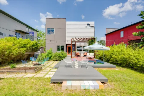 a front view of house with yard and swimming pool