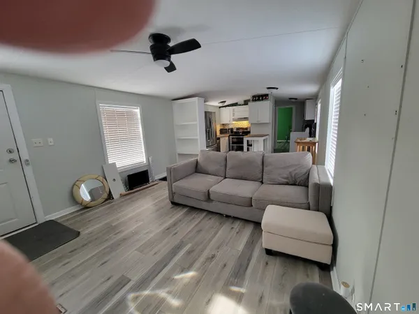 a living room with furniture and a window
