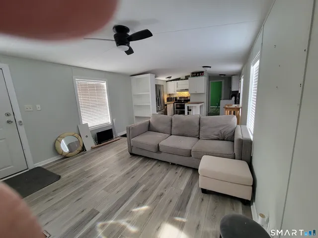 a living room with furniture and a window