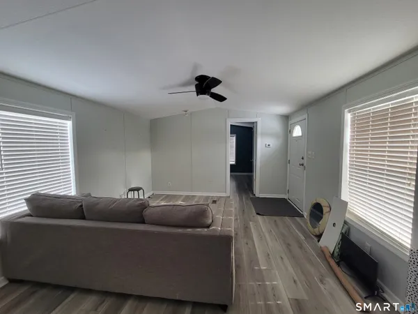 a living room with furniture and a window