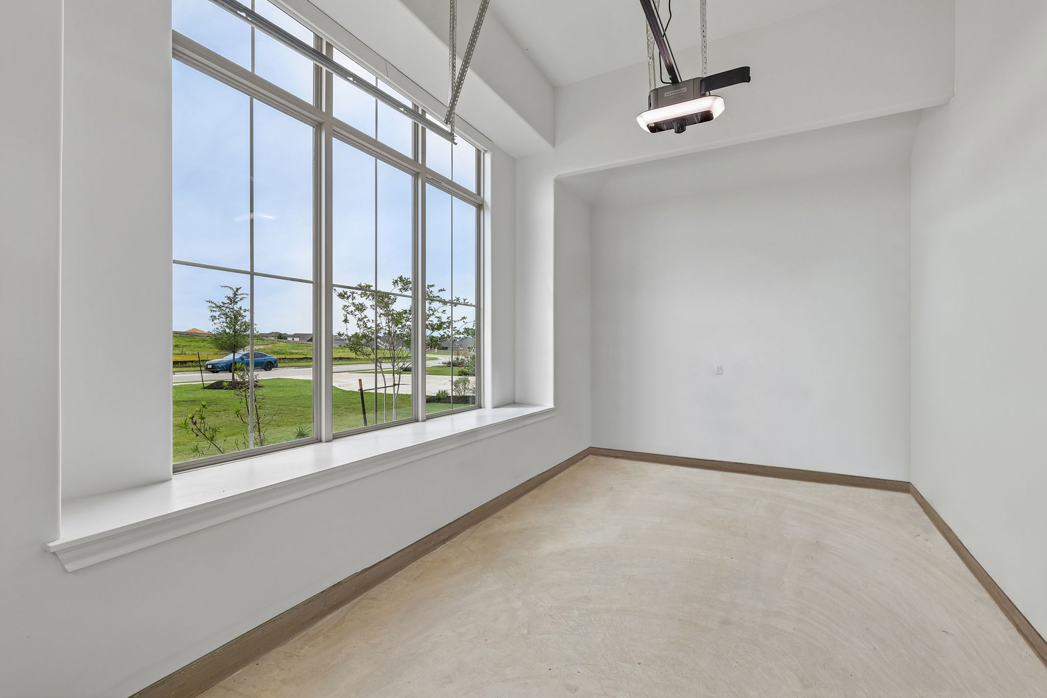 130 Firethorn Loop Bastrop, TX 78602 - Photo 26 of 38 Expansive multi-pane window with a deep sill overlooking a green landscape