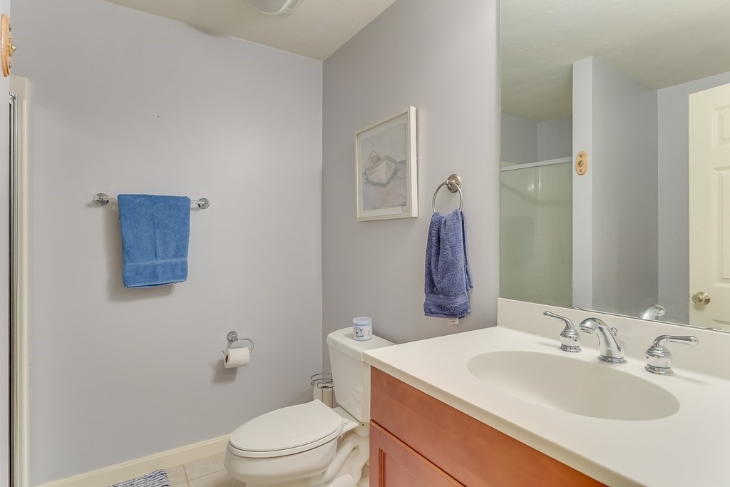25 Rigsdale Way, Unit 25 Plymouth, MA 02360 - Photo 26 of 38 a bathroom with a sink toilet and vanity